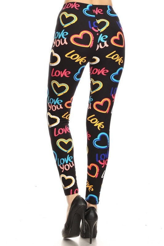 Heart graphic print, full length, high waisted leggings in a fitted style with an elastic waistband. and cuffed hems.