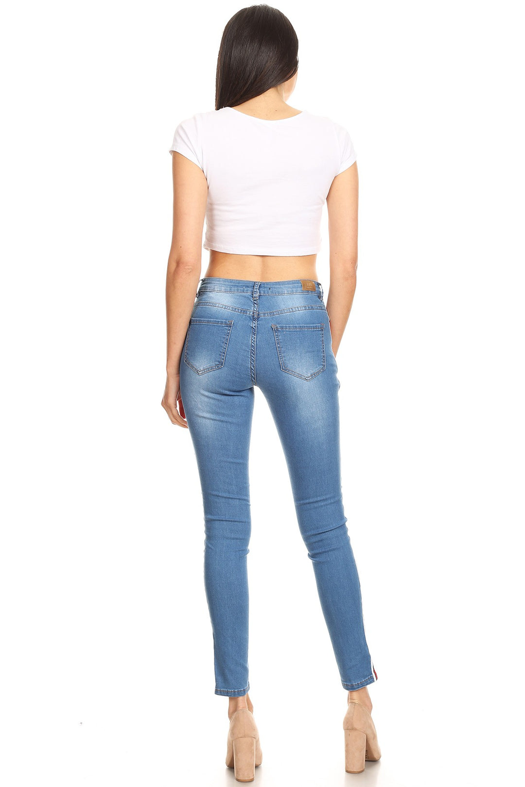 Distressed denim skinny jean with side trim and pockets